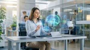 Femme interagit avec écran holographique affichant cerveaux lumineux et flux : objectifs, contenus, évaluations. IA en ingénierie pédagogique.